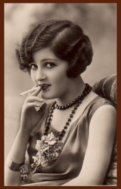 Zelda Fitzgerald in flapper dress holding cigarette