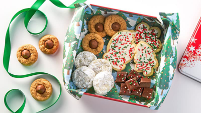 A green box full of holiday cookies