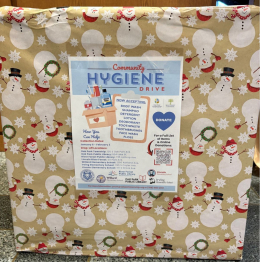 Box covered in snowman paper for hygiene drive