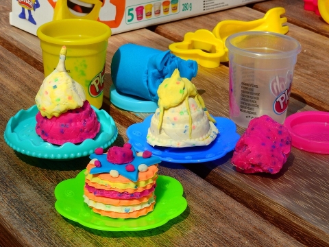 Photo of colorful; playdoh in the shape of ice cream on tiny plates.