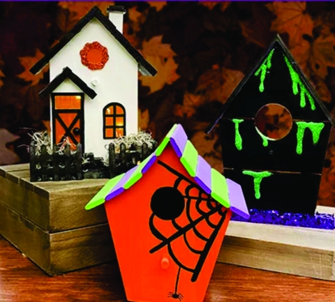 Wooden birdhouses painted in Halloween theme