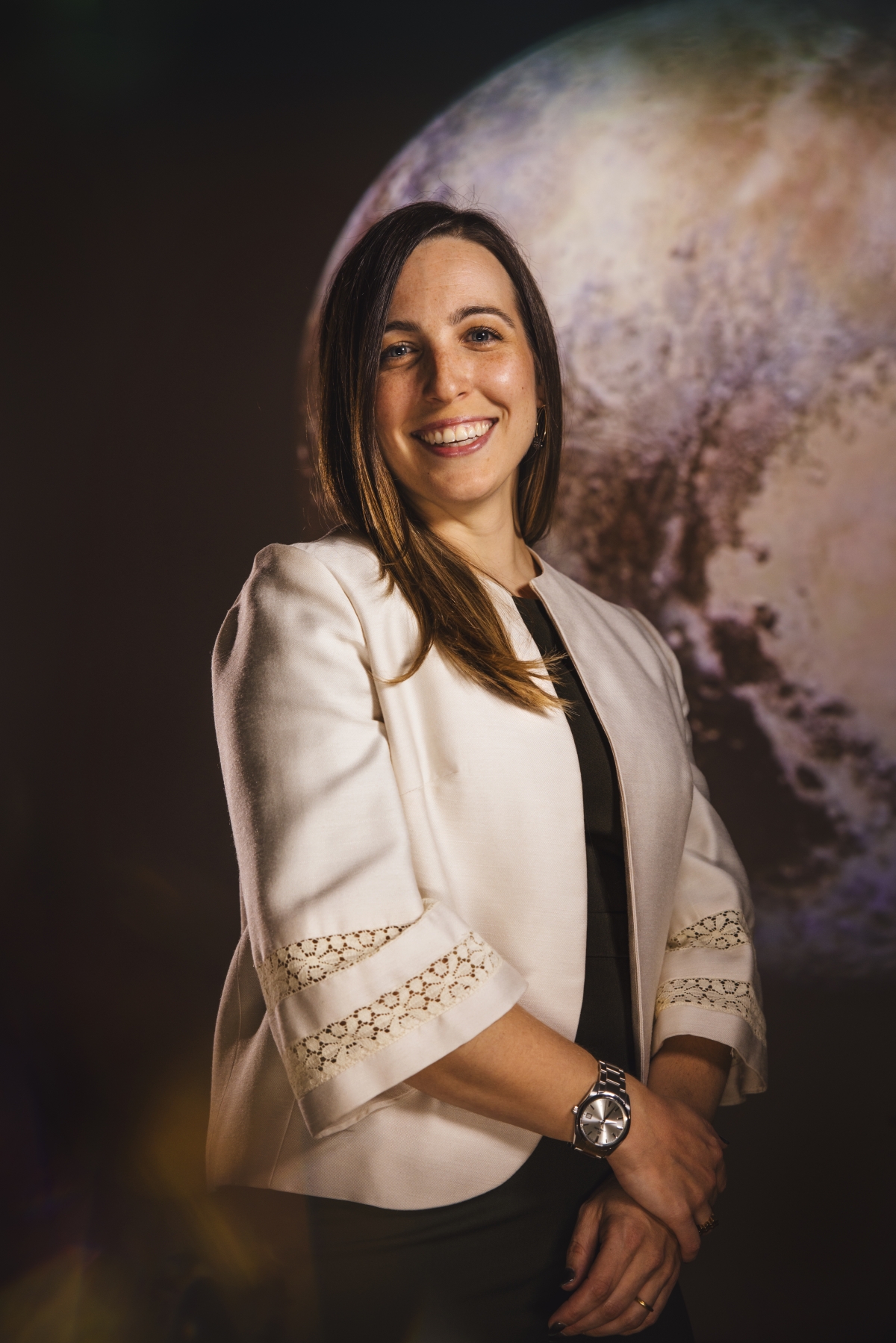 Female astronaut with moon behind her