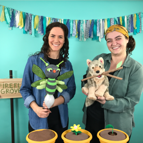 Two women with puppets - a fox and a plant