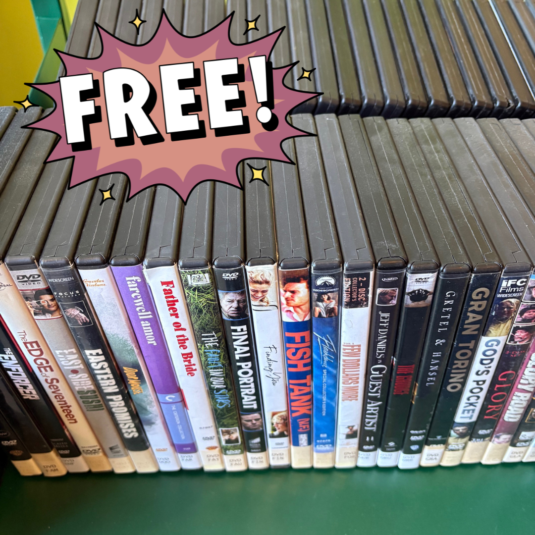 A bunch of DVDs on a cart