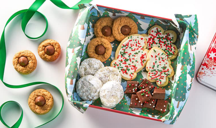 A green box full of holiday cookies