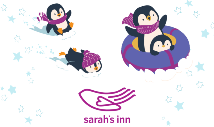 Penguins on inner tubes playing in the snow